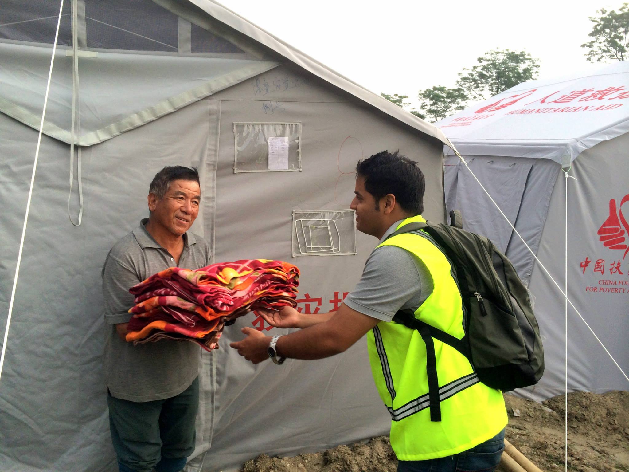 donating some blankets to Nepal's earth quake victims